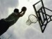 low-angle-view-of-a-man-shooting-a-basket