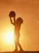 silhouette-of-boy-holding-basketball